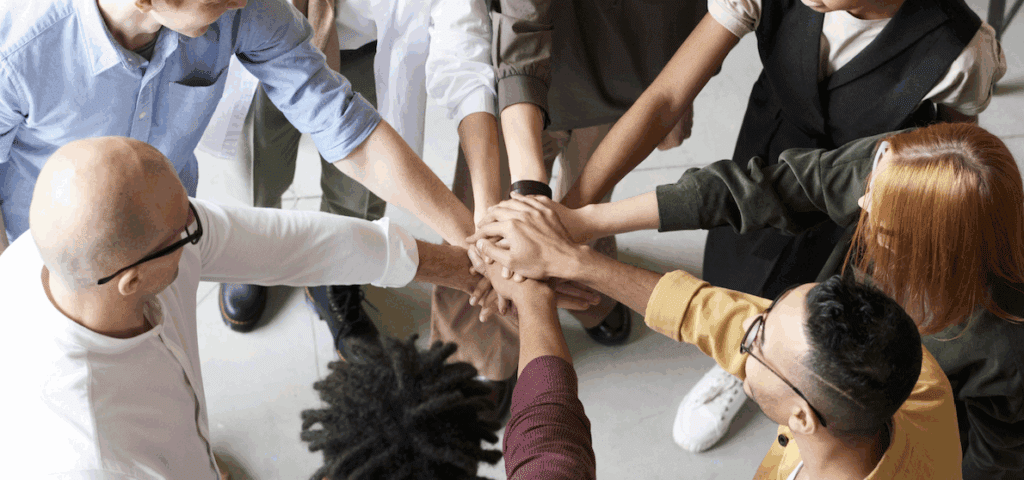 Diverse group of professionals from different cultural backgrounds working together in a bright office setting